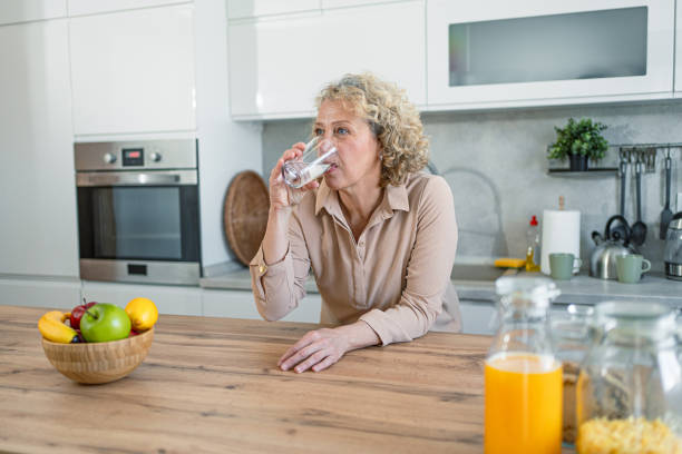 istock Cheerful mature woman in the kitchen 2203394666