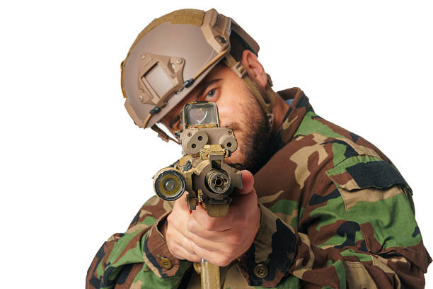 istock Airsoft player aiming with his rifle isolated on white 2203394826