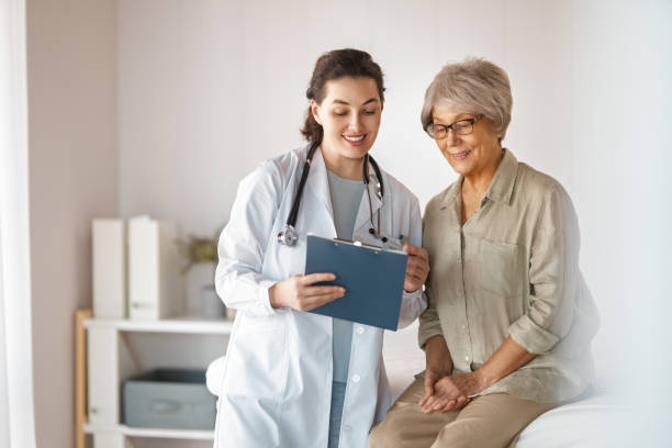 istock patient with a doctor in medical office 2203395393