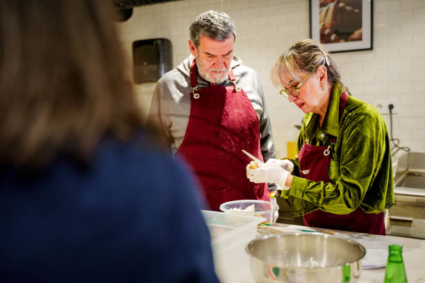 istock Senior Participants in a Hands-On Cooking Class 2203395706