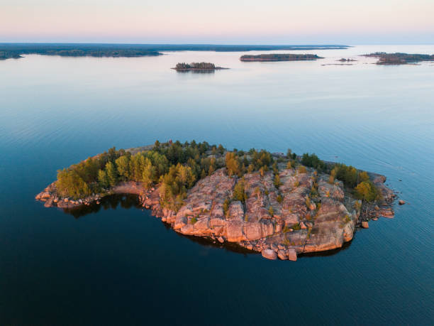 istock Rocky island on a beautiful summer evening in calm 2203396986