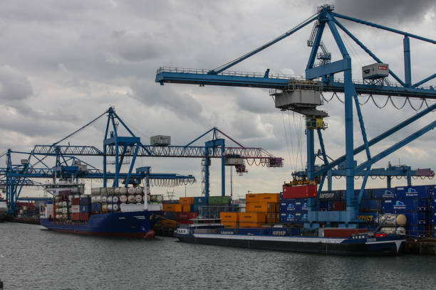 istock Cargo container ship at a container terminal in Rotterdam port, Netherlands 2203399773