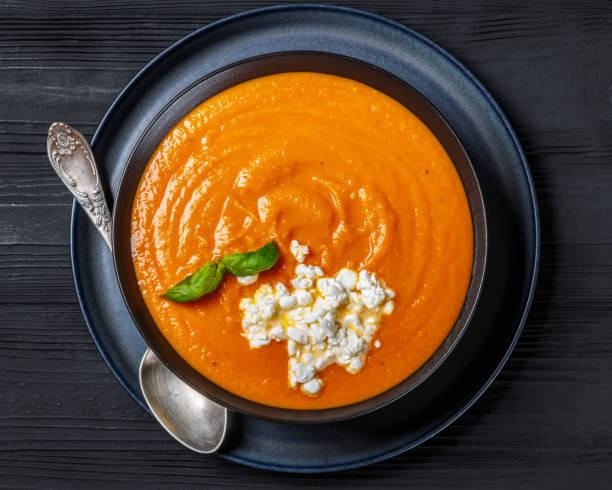 istock roast tomato soup in a bowl, top view 2203399804