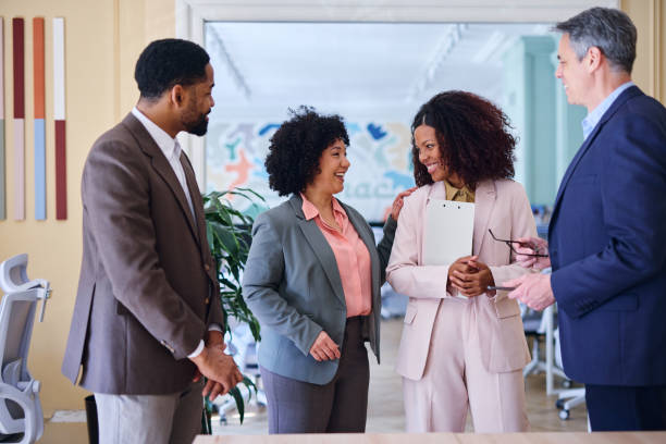 istock Business team collaborating and celebrating success in modern office 2203400702