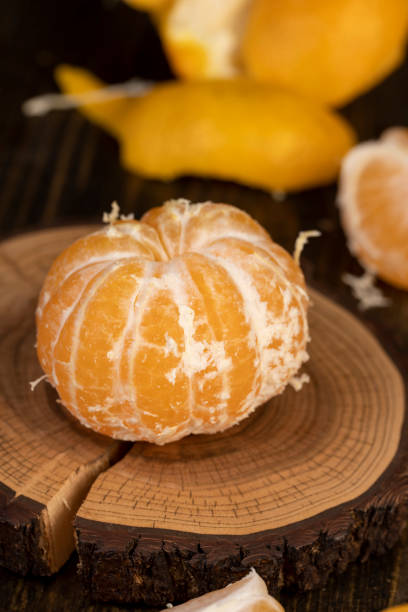 istock peeled orange ripe tangerines on the table 2203401558