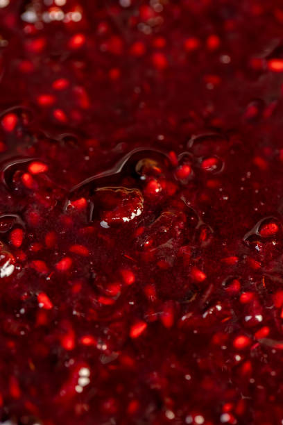 istock Crumpled sweet raspberries with added sugar 2203401746