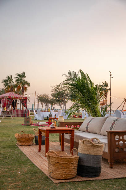 istock Traditional Arabic seating sofa and festive Iftar table with coffee and dates for ramadan fast breaking celebration in outdoor beach side in Abu Dhabi 2203403002