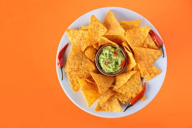 Party appetizer snack including Nachos and Guacamole