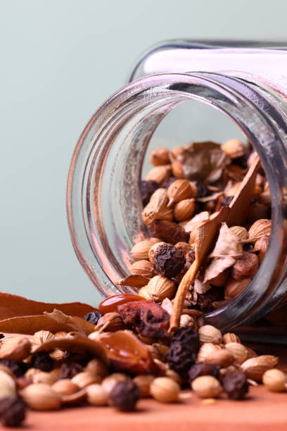 Garam Masala flowing from storage bottle