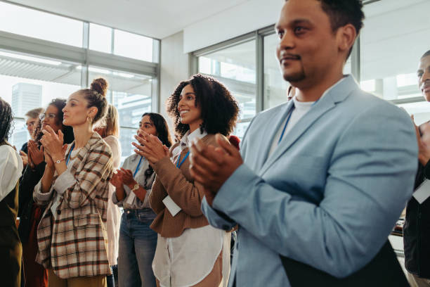 istock Colleagues clapping during a business presentation at the office 2203405129