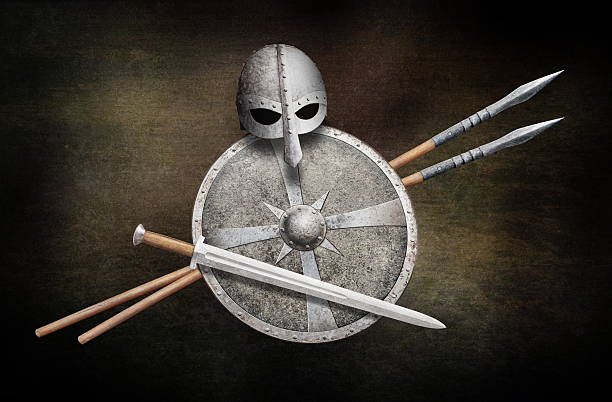 vikings helmet sword two lances and metal shield on dark grunge background