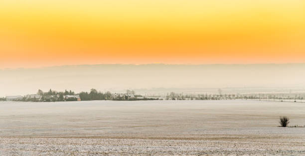 scenic sunrise in snow covered winter landscape in Thuringia, Germany