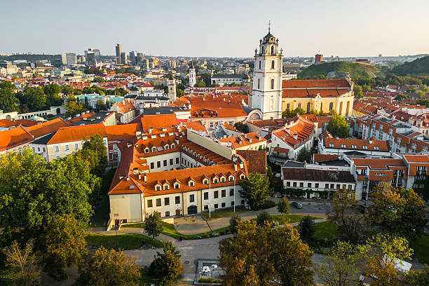 Aerial View of Vilnius Old Town With The University Bell Tower Above the Horizon.