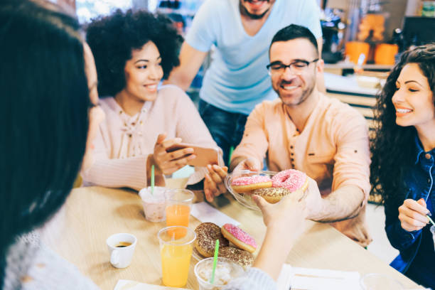 istock Young adults taking selfie in cafe 2203416805