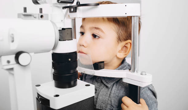 istock A young boy is focused while getting his eyes checked using an ophthalmic instrument in a clinic setting 2203417725
