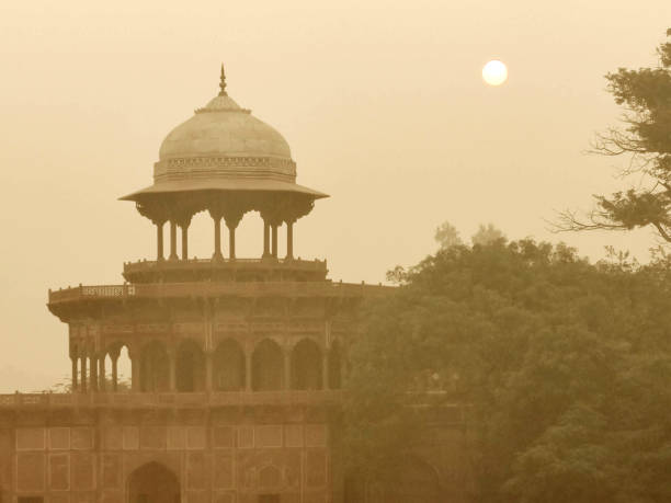 Famous Taj Mahal, the mausoleum located in Agra, India. It is one of the most recognizable structures in the world and is regarded as one of the eight wonders of the world. Black and White, Sepia toned image. Agra, India.