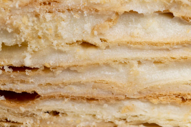 istock layered cake with white sweet cream on a board 2203422677