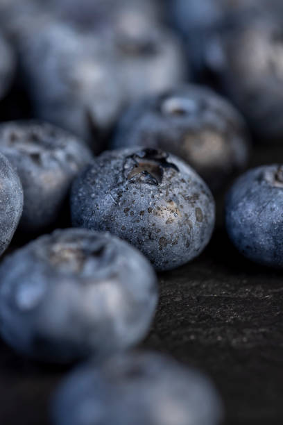 istock a pile of blueberries scattered on the board 2203422682
