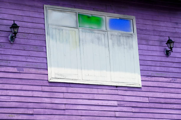 istock Vibrant Purple House with Unique Window Design and Lanterns 2203423100