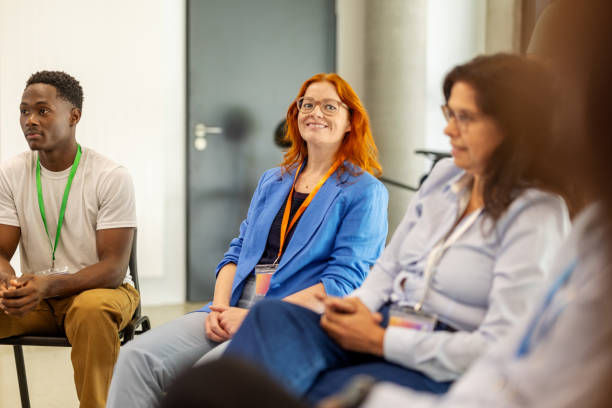 istock Group of professionals seated in a circle during a corporate conference 2203423730