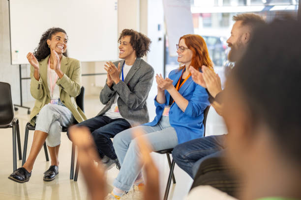 istock Team celebrating success with applause during productive office meeting 2203423737