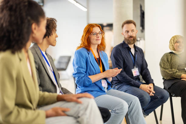 istock Woman business professional collaborating with colleagues during discussion 2203423793