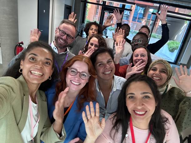 istock Successful seminar concludes with group selfie by business professionals 2203423955