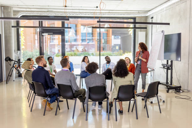 istock Interactive business presentation by woman entrepreneur using flipchart 2203424035