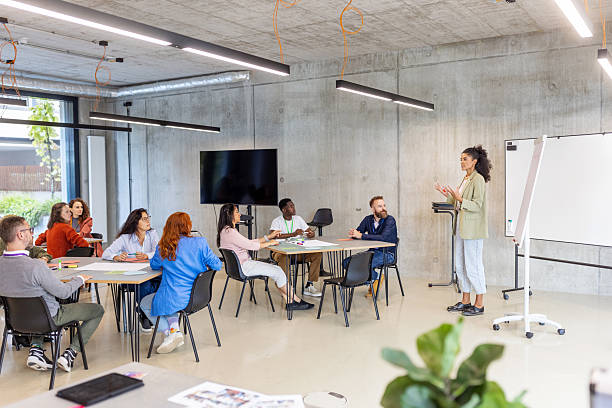 istock Interactive session led by businesswoman with flipchart at seminar 2203424108