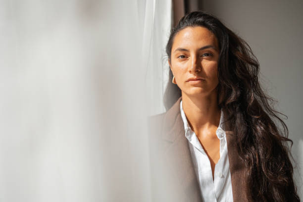 istock Confident woman looking forward in a natural and professional setting 2203424663