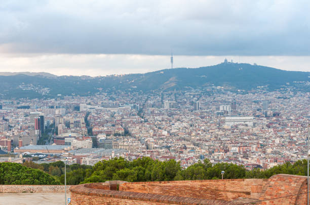 Barcelona, Spain - November 4, 2014: A panoramic view of the city from Montjuic Castle, showcasing the dense urban landscape and the distant hills.