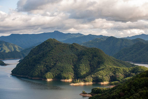 Free Stock Photo of Panoramic view of a lake with mountains and cloudy ...