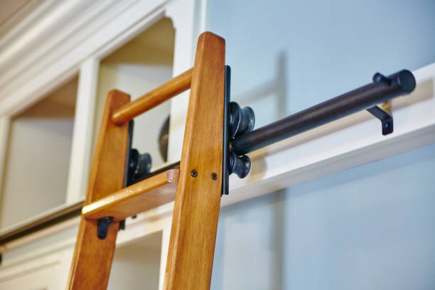 istock Modern Wooden Ladder Against White Wall with Metal Hardware 2203430817