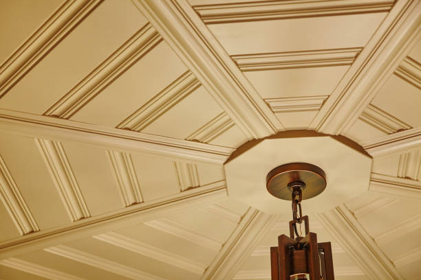 Elegant Coffered Ceiling with Classic Light Fixture, Warm Indoor Ambiance