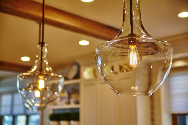 istock Elegant Glass Pendant Lighting in Cozy Interior Setting 2203431190