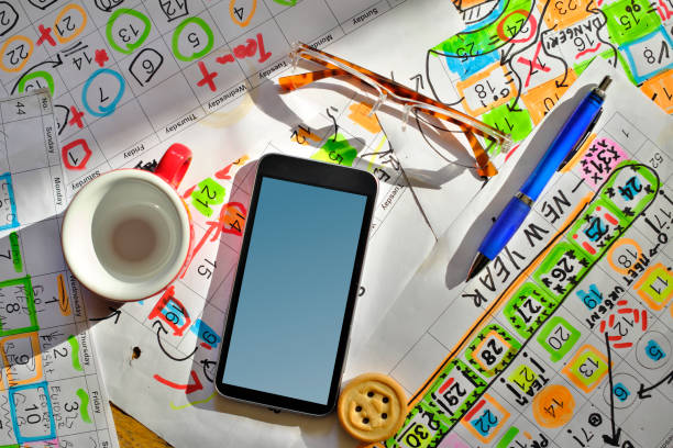 istock Calendars with business appointments and adhesive notes on cluttered desk. Business concept,beat the clock,overwoked,bureaucracy 2203432204