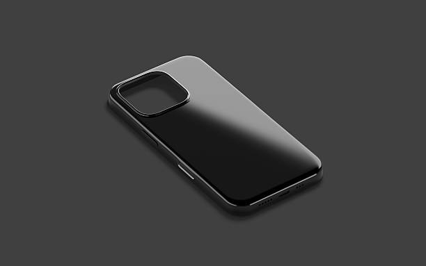 istock Blank black glossy phone case mockup lying, dark background 2203433351