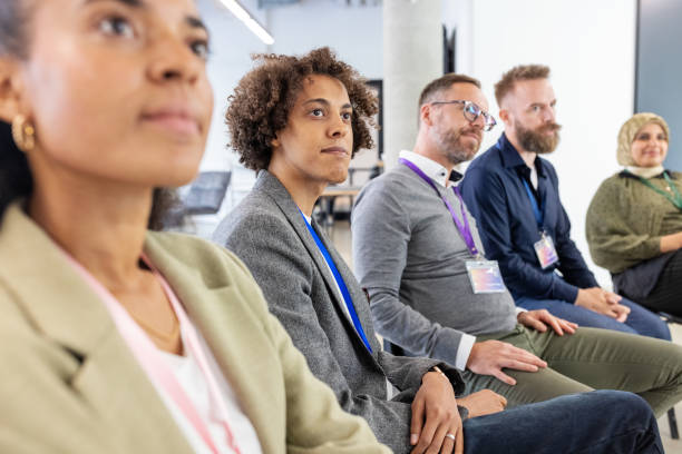 istock Diverse professionals brainstorming and listening during conference 2203433692