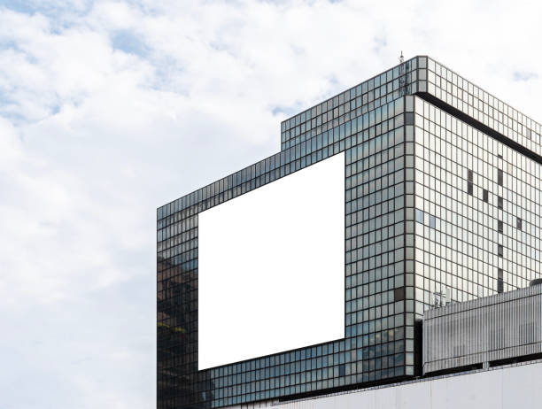 istock Mock up white horizontal large LED display billboard on tower building. clipping path for mockup 2203434098