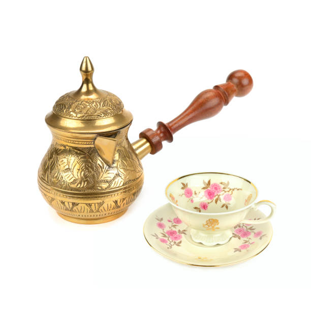 istock Coffee pot (turka) and porcelain vintage cup isolated on white background. 2203436416