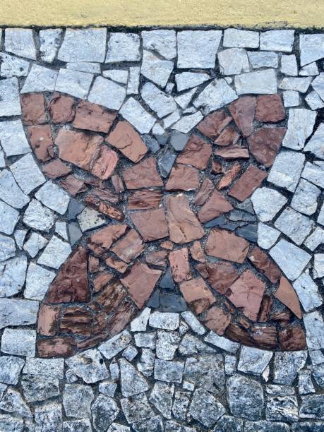istock Rustic stone floor texture with natural variations in color and shape. Earthy tones and rugged details create an authentic, weathered look. Perfect for backgrounds, design elements, or architectural visuals 2203439798