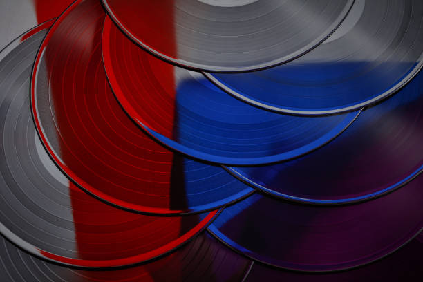 Color music background with vinyl record. Vinyl records texture, music background. Top view. Texture of vintage retro vinyl record. Retro acoustic.
