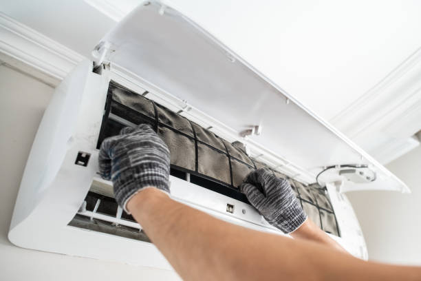 istock Technician with dirty filter of air conditioner 2203446402
