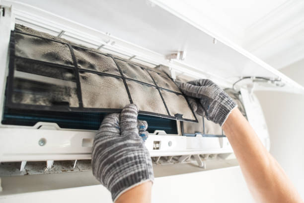 istock Technician with dirty filter of air conditioner 2203446424
