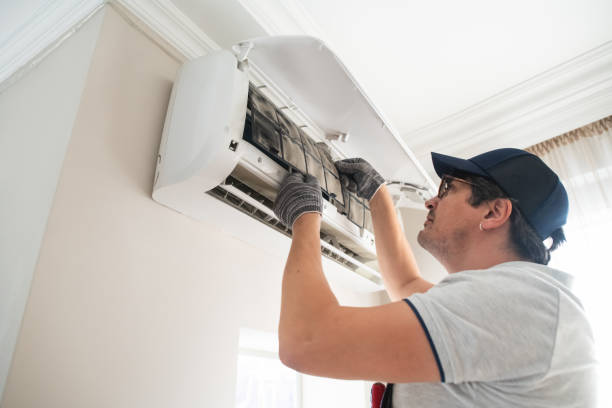 istock Technician with dirty filter of air conditioner 2203446444