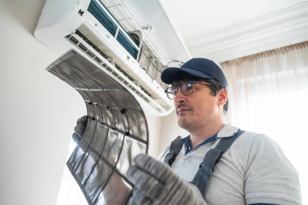 istock Technician with dirty filter of air conditioner 2203446446