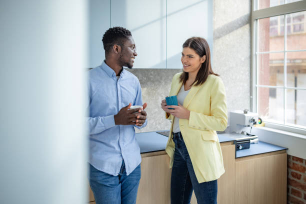 istock Young professionals engaged in a productive discussion in a modern office setting 2203447644