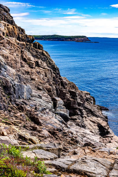 istock Dramatic cliffs lead straight into the sea in Acadia National Park 2203447836