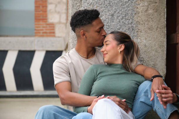 istock Romantic couple showing affection in the city 2203447875