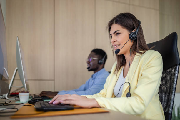 istock Young professionals in a dynamic call center providing support and assistance in real estate transactions 2203449241